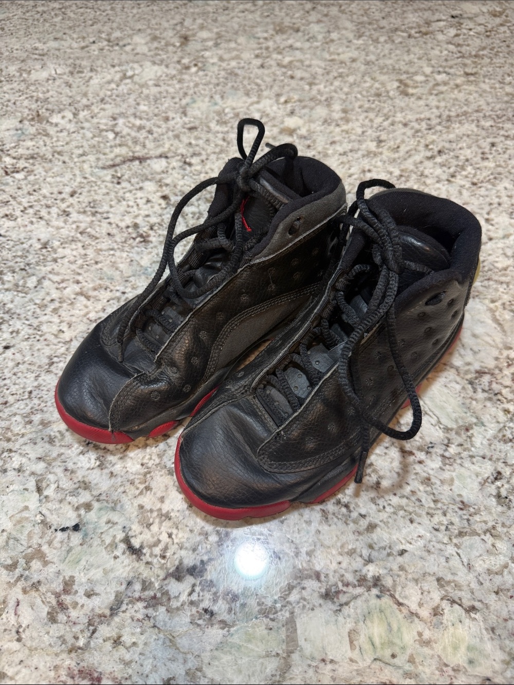 Men's Black Sneakers with Red Sole Accent